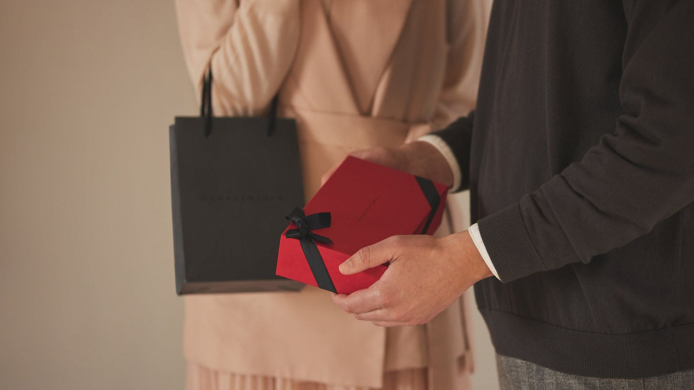 A couple gives each other handmade leather gifts