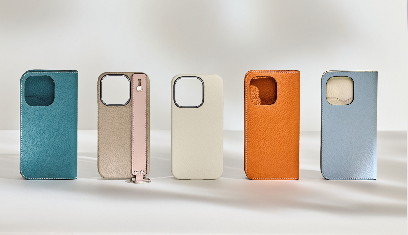 A selection of leather cases for the new iPhone 16 series in various colors and models.